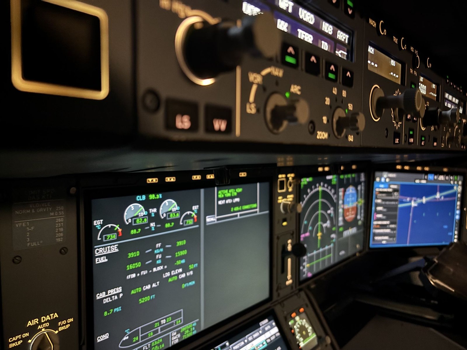 Flight control unit and engine display in a dimly lit flight deck