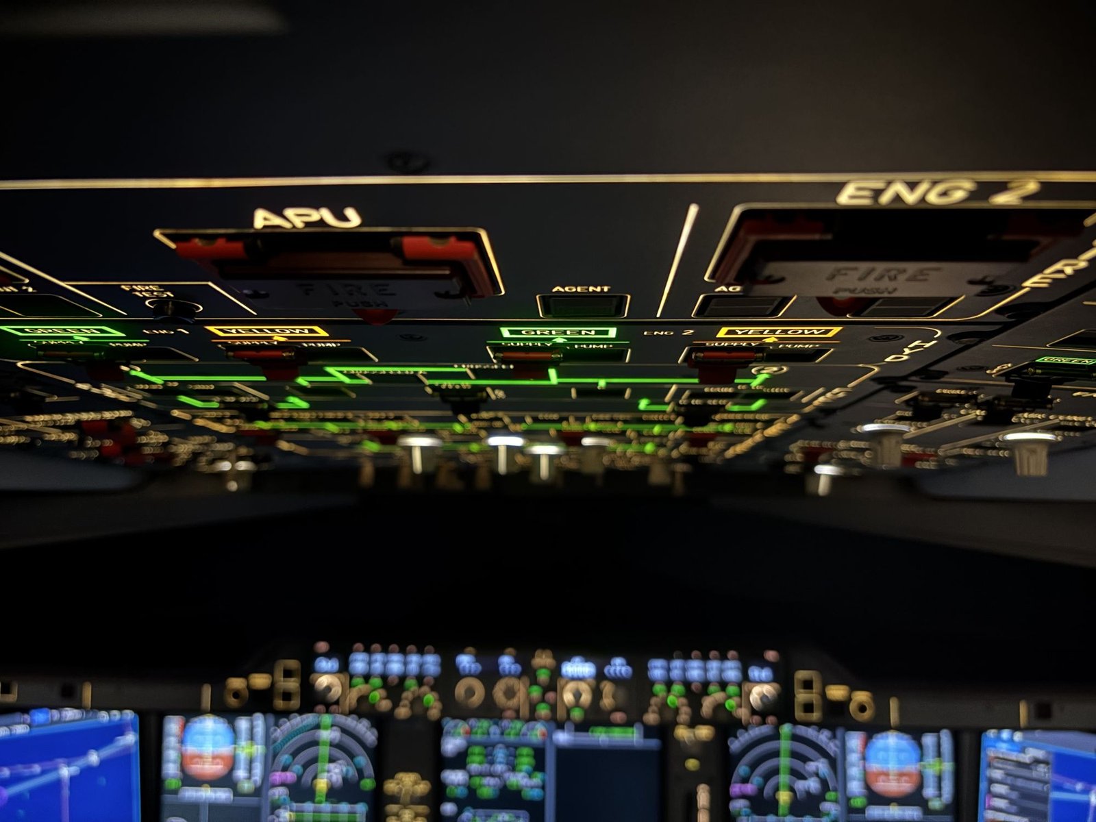 Illuminated overhead panel with APU and engine fire controls